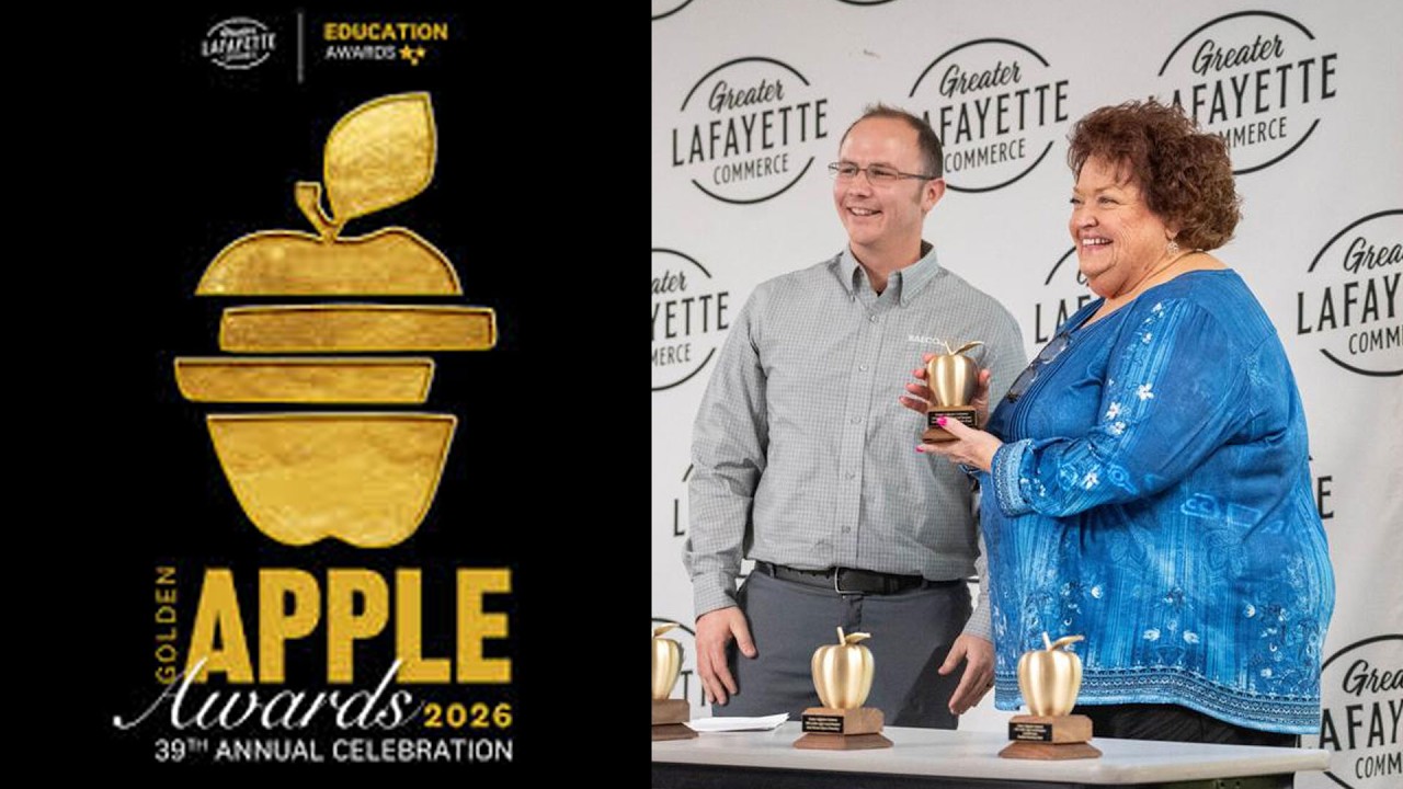 Ann Hammons holding a Golden Apple Award.