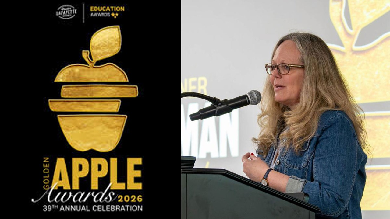 Lisa Merryman speaking at a podium.