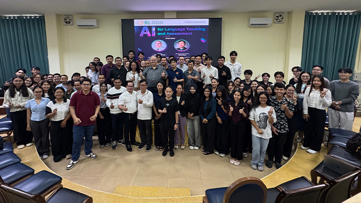 Wayne Wright and Virak Chan surrounded by students from the Royal University of Phnom Penh.